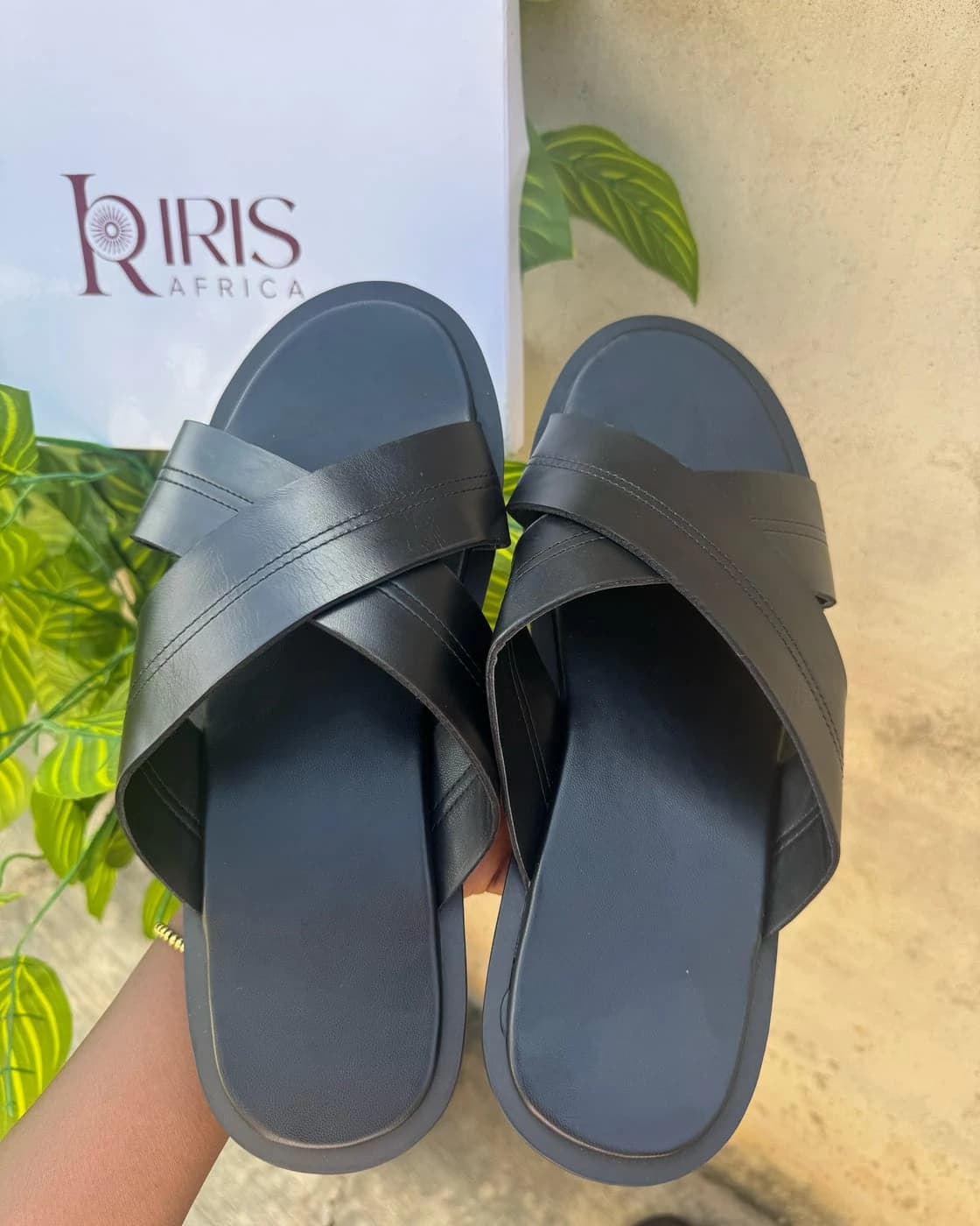 ADE Palm in Black: wide crossed black leather straps with stitched detail over a black footbed